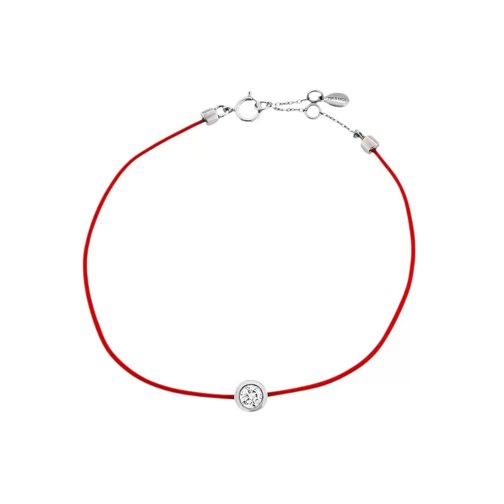Pulsera hilo rojo en oro blanco con diamante talla brillante.