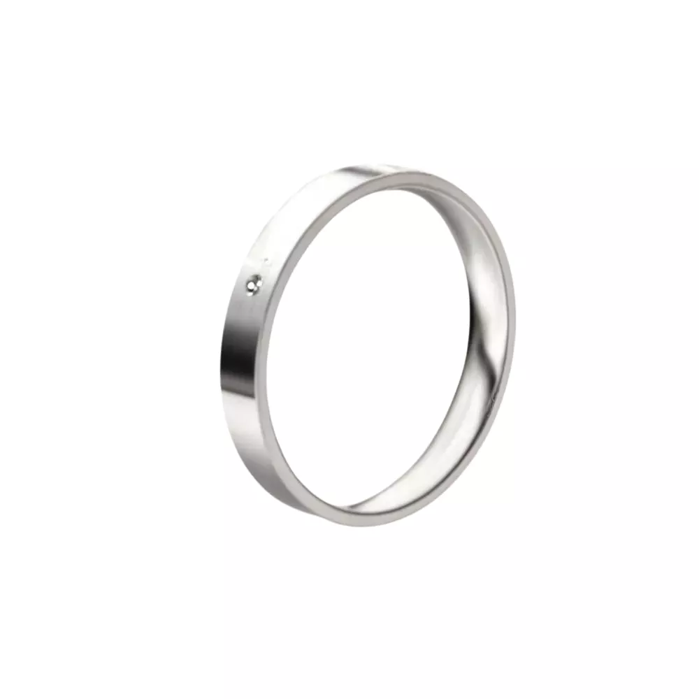 Una alianza cinta en oro blanco puldio con 1 diamante talla brillante. Espesor: 3 mm. Peso: 3 gr.