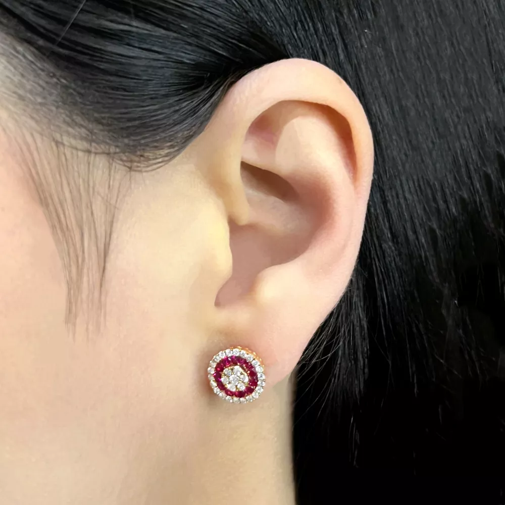 Earrings in rose gold set with brilliant-cut diamonds and rubies.