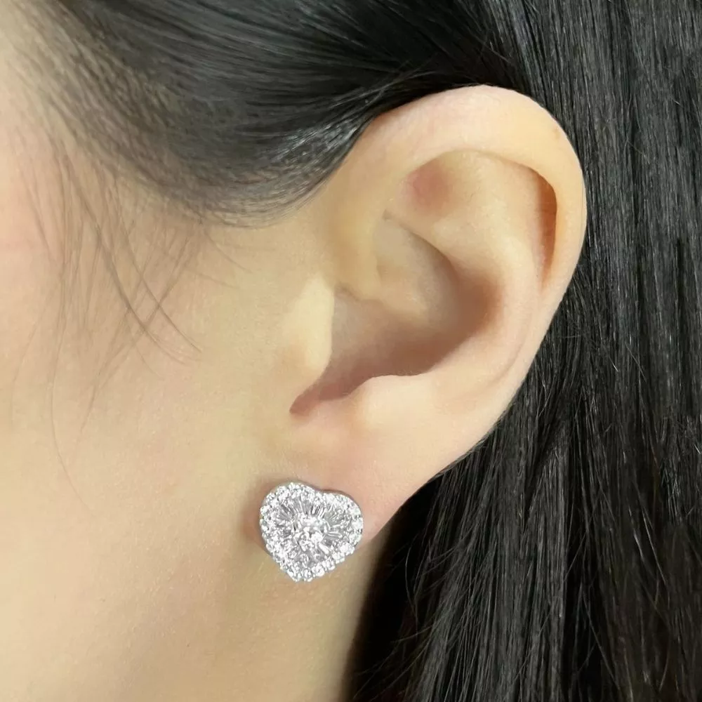 Earrings in white gold set with baguette and brilliant-cut diamonds.