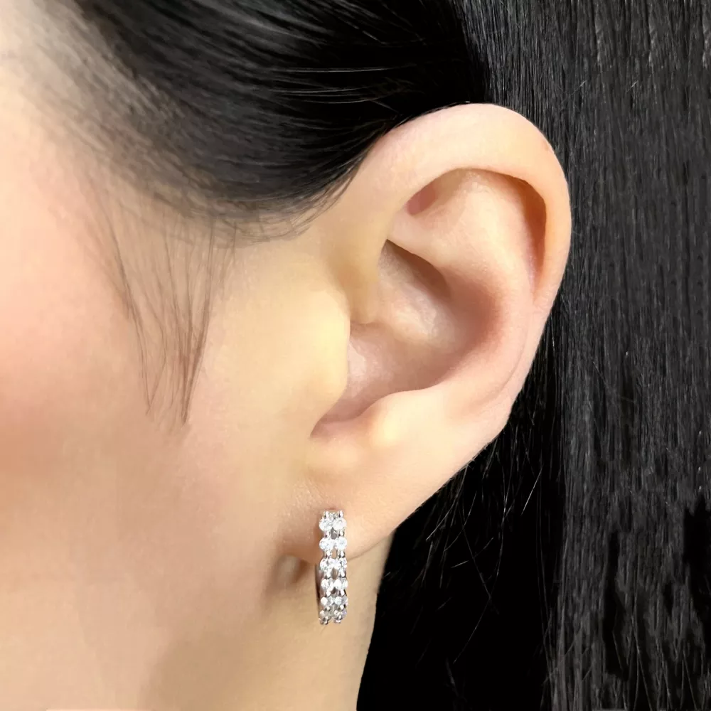 Hoop earrings in white gold set with brilliant-cut diamonds.