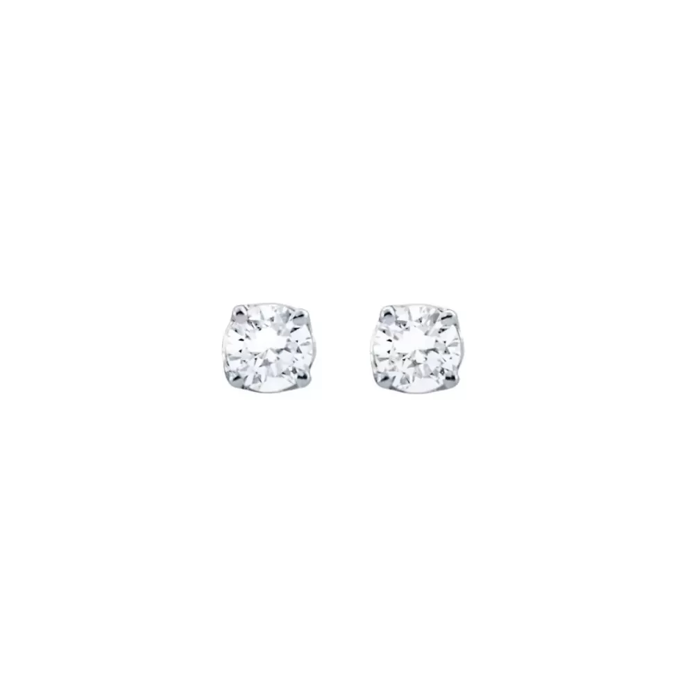 Aros solitarios en oro blanco con diamantes talla brillante (0.20 ct, color G-H, pureza VS2).