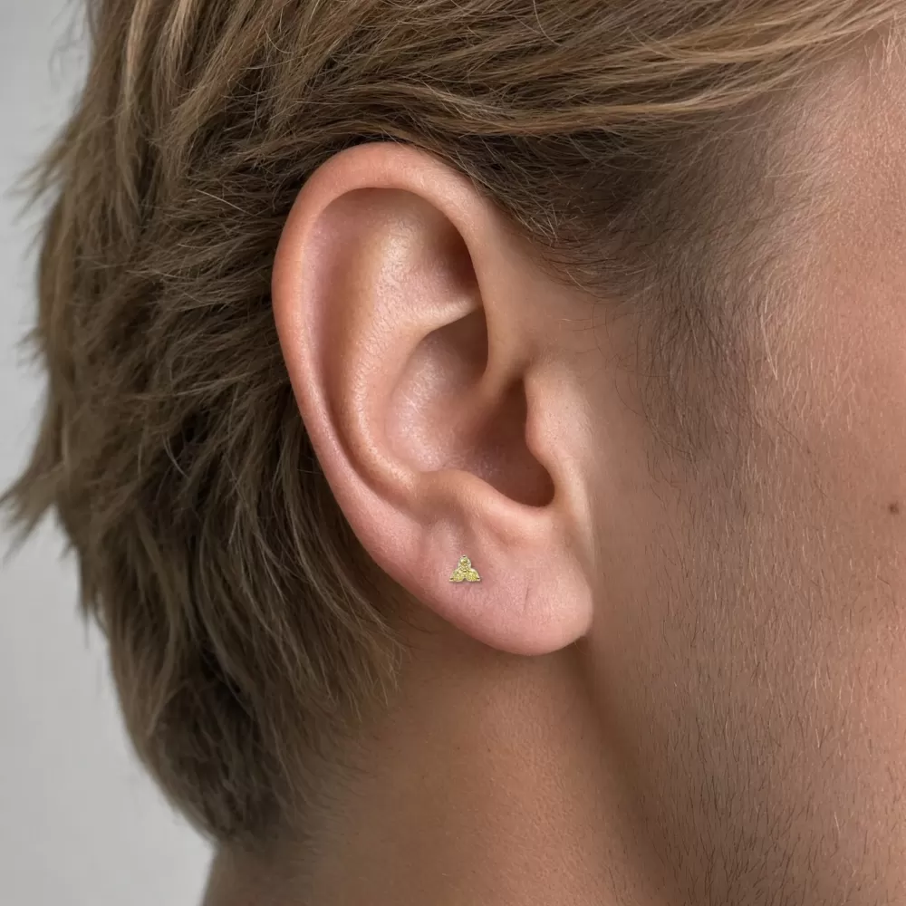 Piercing en oro amarillo con diamantes Fancy Yellow talla brillante.