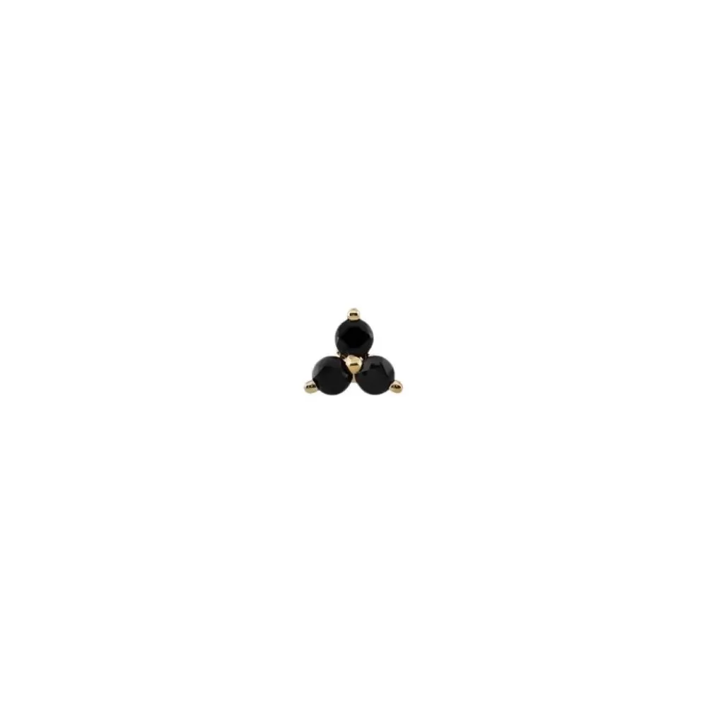 Piercing en oro amarillo con diamantes Fancy Black talla brillante.