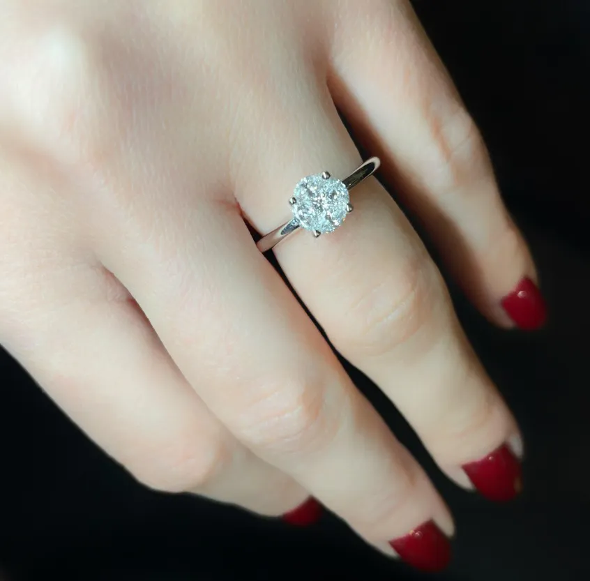 Illusion Solitaire ring in white gold set with marquise-cut and princess-cut diamonds (Visually displaces: 1.258 ct).