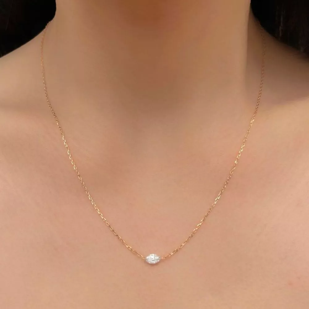 Necklace in rose gold set with marquise-cut diamonds.