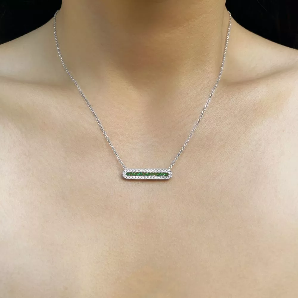 Necklace in white gold set with brilliant-cut emeralsd and brilliant-cut diamonds.