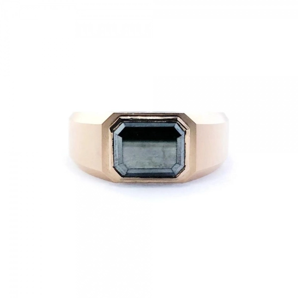 Ring in rose gold set with rectangle-cut Fancy Black diamond.