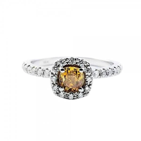 Ring in white gold set with cushion-cut Fancy Deep Yellow-Orange diamond and brilliant-cut colorless diamonds.